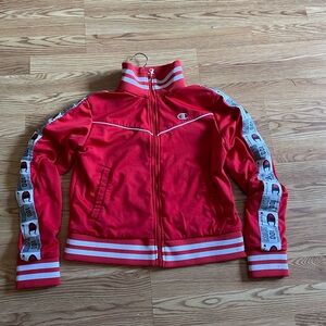 A semi new red Champion zip up athletic hoodie.